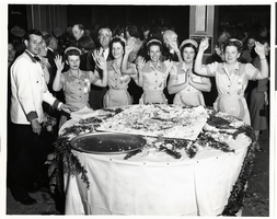 Photograph of a Desert Inn waiter and waitresses at the Desert Inn's first anniversary party, Las Vegas, Nevada, April 1951