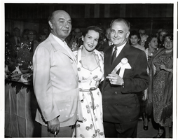 Photograph of Joe Bock, Wilbur Clark and an unidentified woman at the Desert Inn's first anniversary party, Las Vegas, Nevada, April 1951