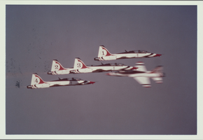 Photograph of Thunderbirds planes performing aerial stunts, 1980