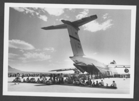 Photograph of people looking at a C-5 Galaxy military transport aircraft jet at Nellis Air Force Base, Nevada, October 14, 1979