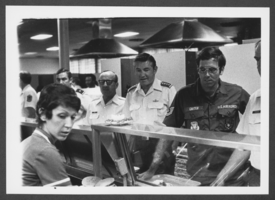 Photograph of military personnel in cafeteria line, Nellis Air Force Base, Nevada, circa 1970s