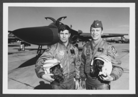 Photograph of Lieutenant Richard Fleitz and Captain Mark Christman after milestone flight in F-111, Nellis Air Force Base, Nevada, February 9, 1976