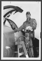 Photograph of Lieutenant Thomas Milligan beside an F-111 bomber, Nellis Air Force Base, Nevada, February 23, 1976