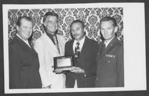 Photograph of Colonel George T. Anton receiving sn award, Nellis Air Force Base, Nevada, October 5, 1976