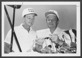Photograph of Major General James Knight, Jr. and Senator Howard Cannon at a golf tournament, Nellis Air Force Base, Nevada, May 31, 1976