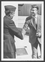 Photograph of Las Vegas Mayor Bill Briare with an officer at Nellis Air Force Base, Nevada, March 27, 1983