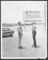 Photograph of Councilman Dan Gray and Mayor Clarence Cleland in front of the City of North Las Vegas sign, North Las Vegas, Nevada, June 19, 1973
