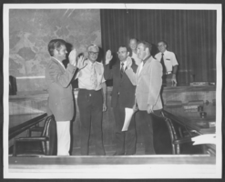 Photograph of four officials taking an oath of office, North Las Vegas, Nevada, June 14, 1973
