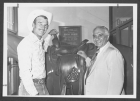 Photograph of North Las Vegas Police Chief William Tharp accepting a saddle donated by the Silver Nugget Casino, North Las Vegas, Nevada, September 9, 1981