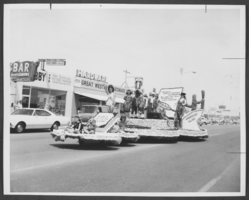 Photograph of people on the Anderson Dairy float at a parade, North Las Vegas, Nevada, May, 1968