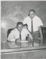 Photograph of Al Sawyer sworn in by City Councilman Jack R. Petitti, North Las Vegas, Nevada, circa 1960s