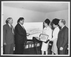 Photograph of officials studying plans for Nellis Industrial Park, Las Vegas, Nevada, circa 1960sa