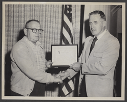 Photograph of North Las Vegas Municipal Judge Ray Daines presenting a certificate to John Kulikowski, North Las Vegas, Nevada, March 20, 1974