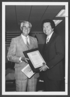 Photograph of R. Guild Gray and Manuel Cortez at an award ceremony, 1981