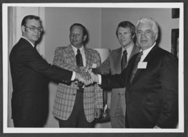Photograph of E.M. "Al" Gunderson, Harry Reid, and others, 1973