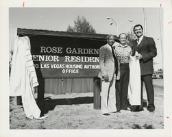 Photograph of the unveiling flag poles and commemorative sign at the Rose Garden Senior Citizens Housing Complex, North Las Vegas, November 10, 1981