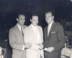 Photograph of Joey Bishop, Donn Arden and Vic Damone in a New York night club, circa early 1950s