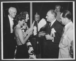 Photograph of Wilbur Clark and singers on the occasion of the first anniversary of Clark's Desert Inn opening, Las Vegas, Nevada, April 1951
