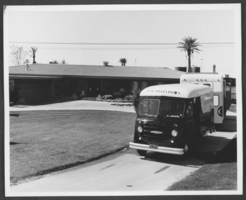 Photograph of CBS Television trucks arriving at Wilbur Clark's home, circa 1950s