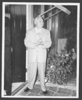 Photograph of Wilbur Clark standing outside his home, Las Vegas, Nevada, circa 1950s