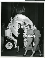 Photograph of three unidentified women walking in front of the Sands Hotel and Casino, Las Vegas, circa late 1950s - early 1960s