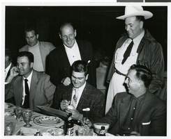Photograph of Jack Entratter with a group of unidentified men at the Sands Hotel and Casino, Las Vegas, circa 1951-1955