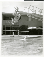 Photograph of an unidentified diving grandmother at the Sands Hotel and Casino, Las Vegas, circa 1965
