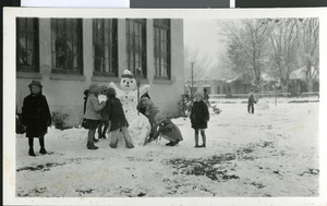 Photograph of school children making a snowman, Las Vegas, January 10, 1930