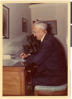 Photograph of Dr. Frank Jean at his desk, Wesley Palms, circa 1964