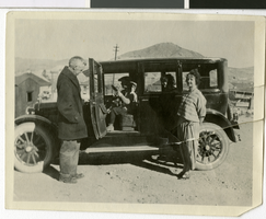 Photograph of Sherwin Garside and family in and around a car, Tonopah, Nevada, 1925.