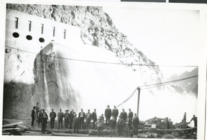 Photograph of men standing in front of the Boulder Dam, Las Vegas, circa 1930s