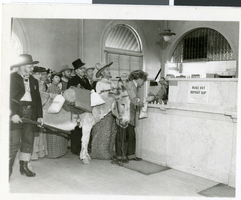 Photograph of a prospector depositing silver dollars at First State Bank, Las Vegas, circa 1930s