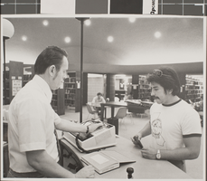 Photograph of Chester David and patron, University of Nevada, Las Vegas, circa 1970s