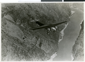 Photograph of plane over the Colorado River, circa 1940s