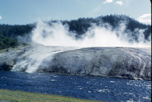 Slide of a geyser and river at Yellowstone National Park, circa 1970s to 1980s