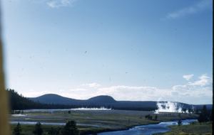 Slide of a geyser and Firehole River at Yellowstone National Park, circa 1970s to 1980s