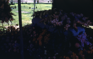 Slide of a casket and flowers, circa 1950s
