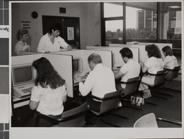 Photograph of people using computers at the James R. Dickinson Library, University of Nevada, Las Vegas, 1986