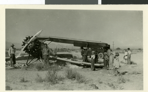 Photograph of Fred Wilson and others near a plane, Las Vegas, 1929
