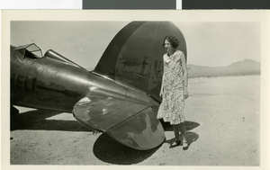 Photograph of Maurine Wilson by an airplane, Las Vegas, 1929