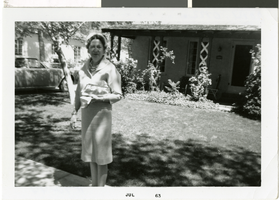 Photograph of Maurine Wilson in front of a house, Nevada, 1963
