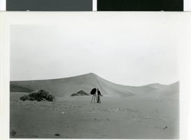Photograph of a photographer in Death Valley, California, circa 1930s to 1950s