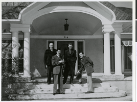 Photograph of four men on the porch of the Von Tobel home, Las Vegas, February 27, 1944