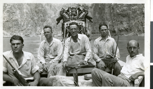 Photograph of five men in a boat, circa 1930s