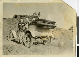Photograph of Dave Conger and his children at the Valley of Fire, circa 1920s-1930s