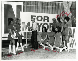 Photograph of Oran K. Gragson putting up a poster for his re-election campaign, Las Vegas, Nevada, circa 1960s