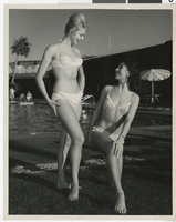 Photograph of Susan Briggs and Valda Boyne Esau posing at Stardust Pool for the National Beverage Association, Las Vegas, November 1960