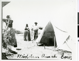 Photograph of three people at Hidden Ranch Camp, Pahrump, Nevada, circa 1880s-1900s