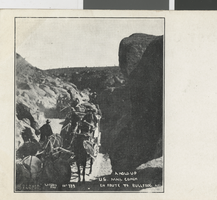Postcard showing the robbery of a United States Mail coach en route to Bullfrog, Nevada, circa 1900s-1910s