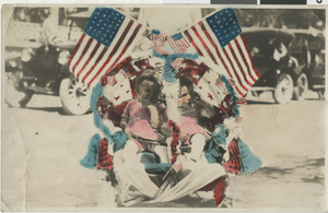Photograph of two children with American flags and patriotic decorations, Nevada, circa 1900s-1910s